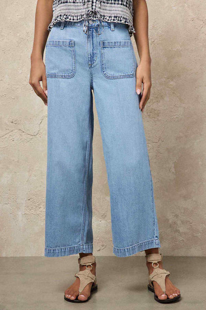 Light blue wide-leg denim pants with elastic drawstring waist and front patch pockets.