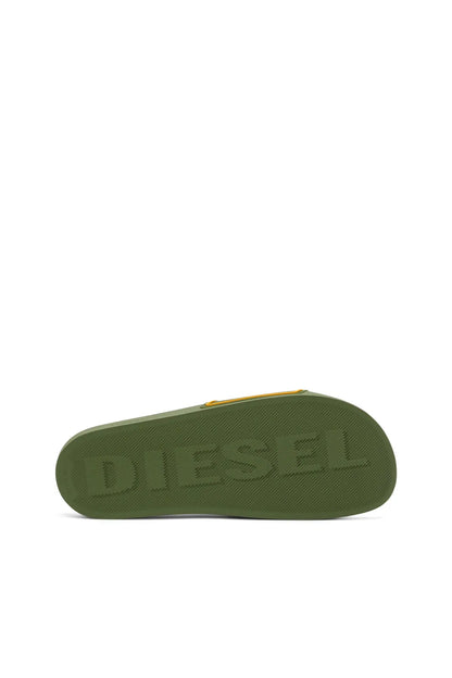 Green slide sandal outsole with Diesel lettering