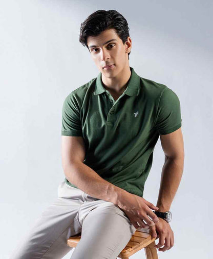 Fitted dark green polo shirt with button placket and small embroidered chest logo.