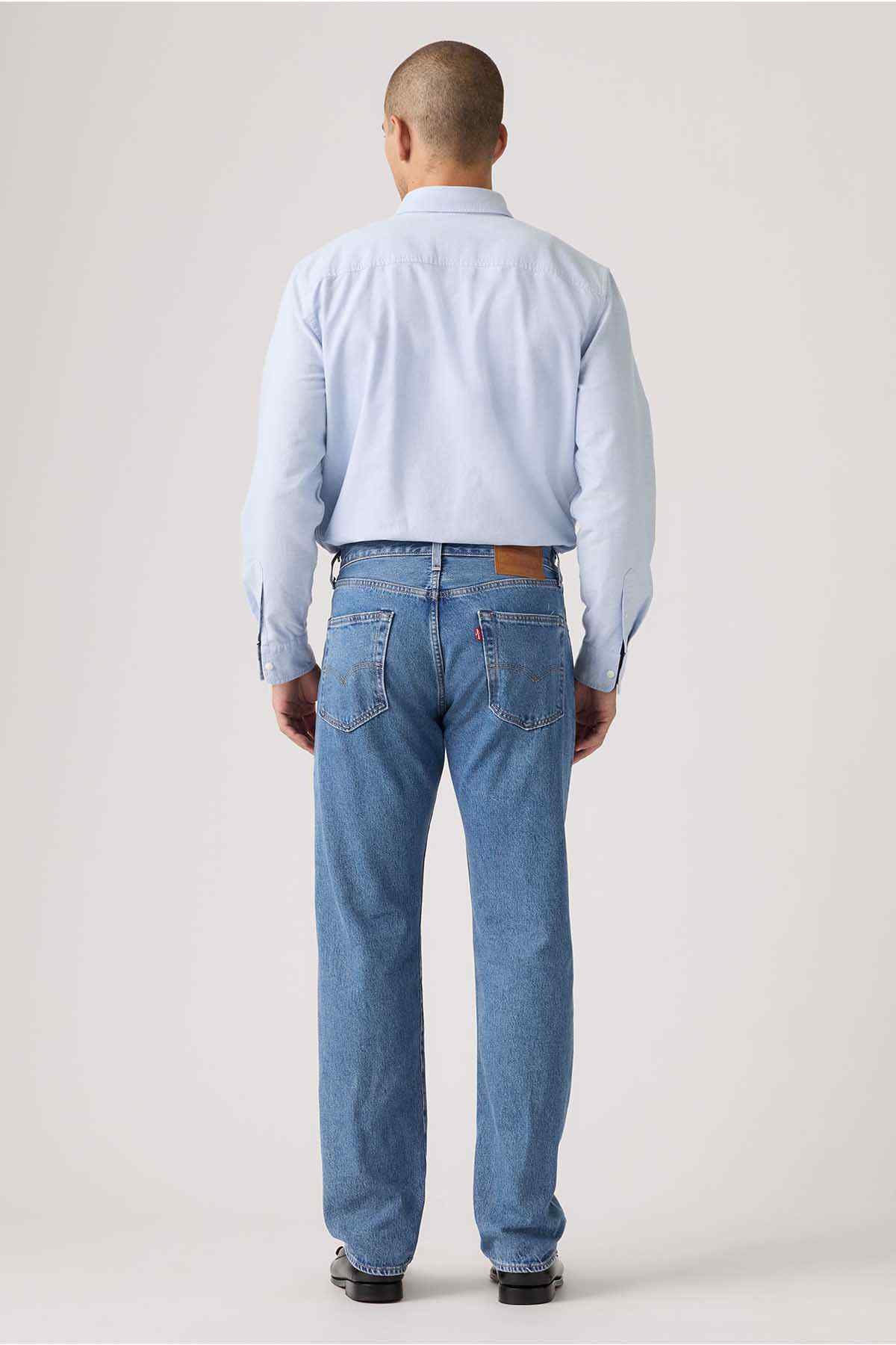 Blue denim jeans back view with belt loops and two back pockets