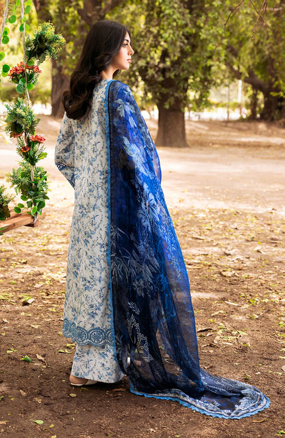 Blue-and-white floral kurta outfit with long flowing dupatta, side view