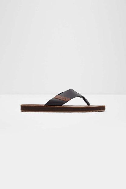 ALDO black slide sandals with thong strap and flat brown leather sole