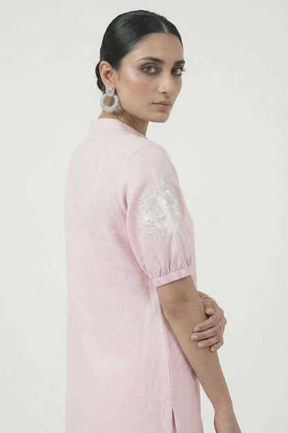 Light pink kurta sleeve and shoulder with embroidered floral motif, side view