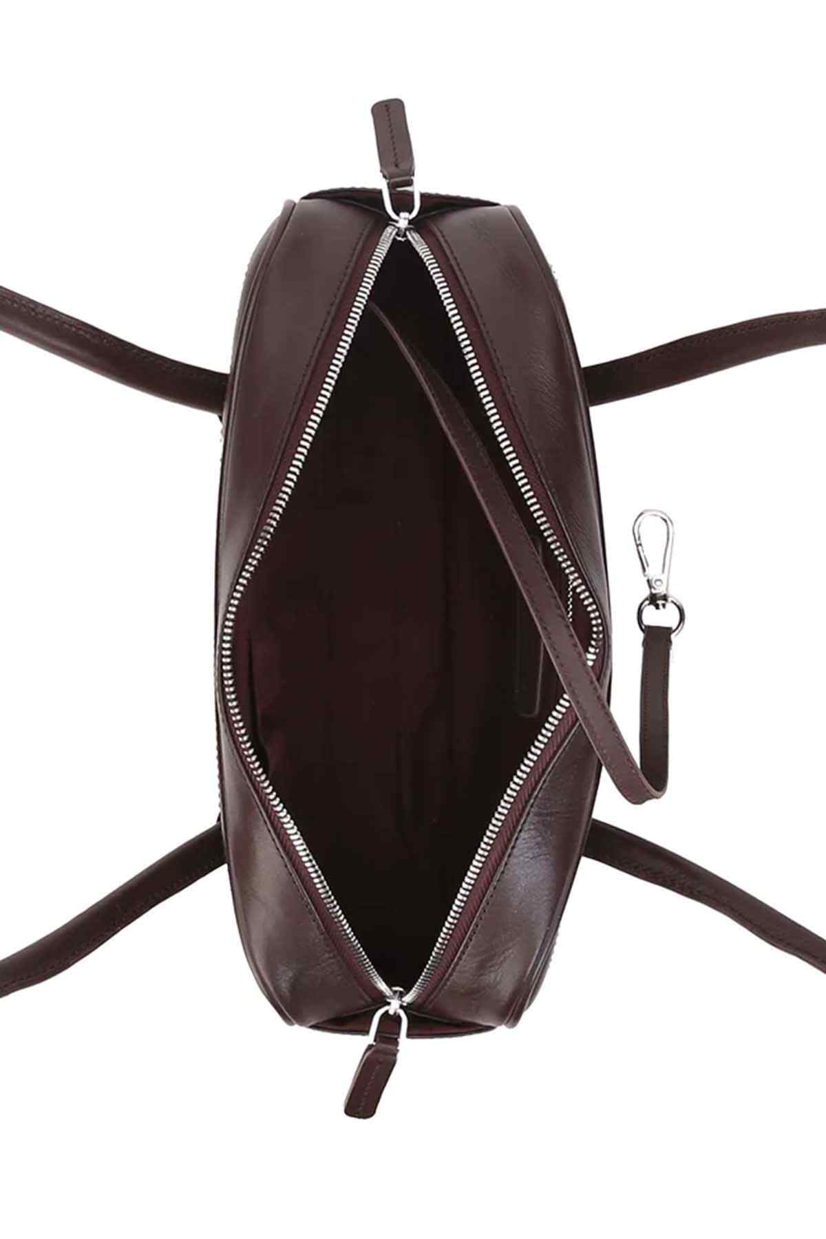 Dark-brown oval handbag with front zipper and long strap with metal rings.