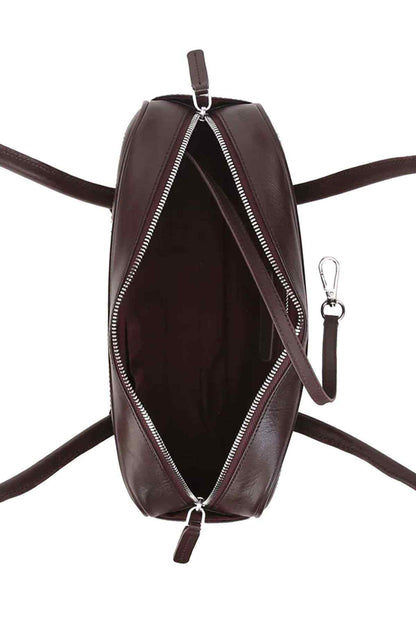 Dark-brown oval handbag with front zipper and long strap with metal rings.