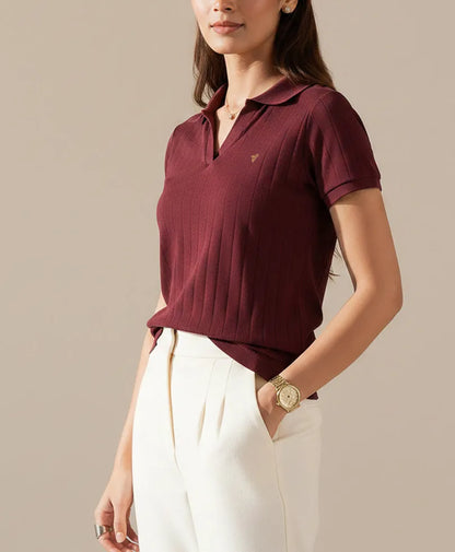 Fitted maroon knit polo shirt with collar, short sleeves, and button placket at front