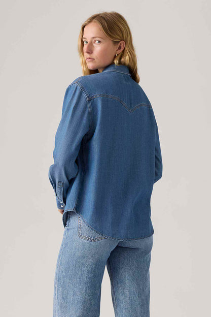 Women's Levi's med indigo denim shirt back view with yoke and curved hem
