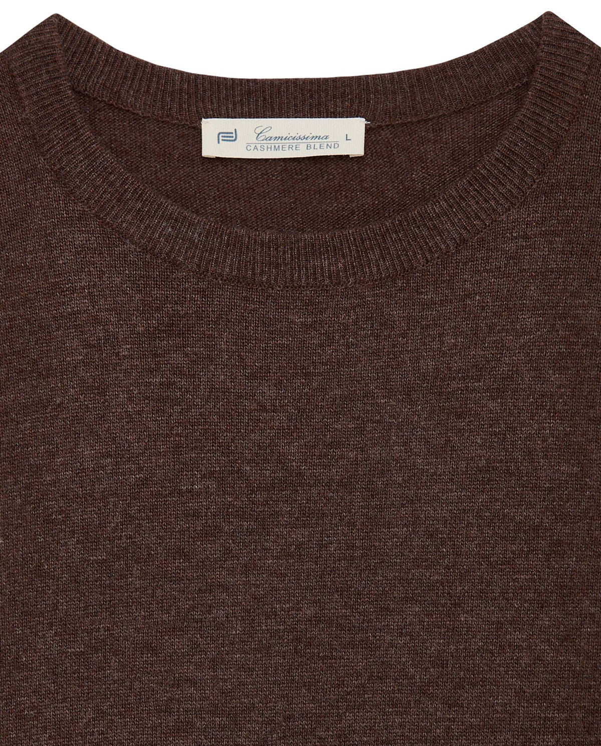 Brown crewneck knit sweater close-up with ribbed neckline and brand label