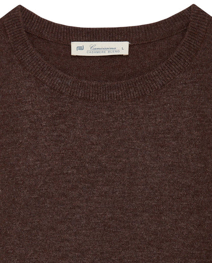 Brown crewneck knit sweater close-up with ribbed neckline and brand label