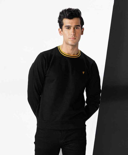 Fitted black crewneck sweatshirt with ribbed yellow collar and small chest logo