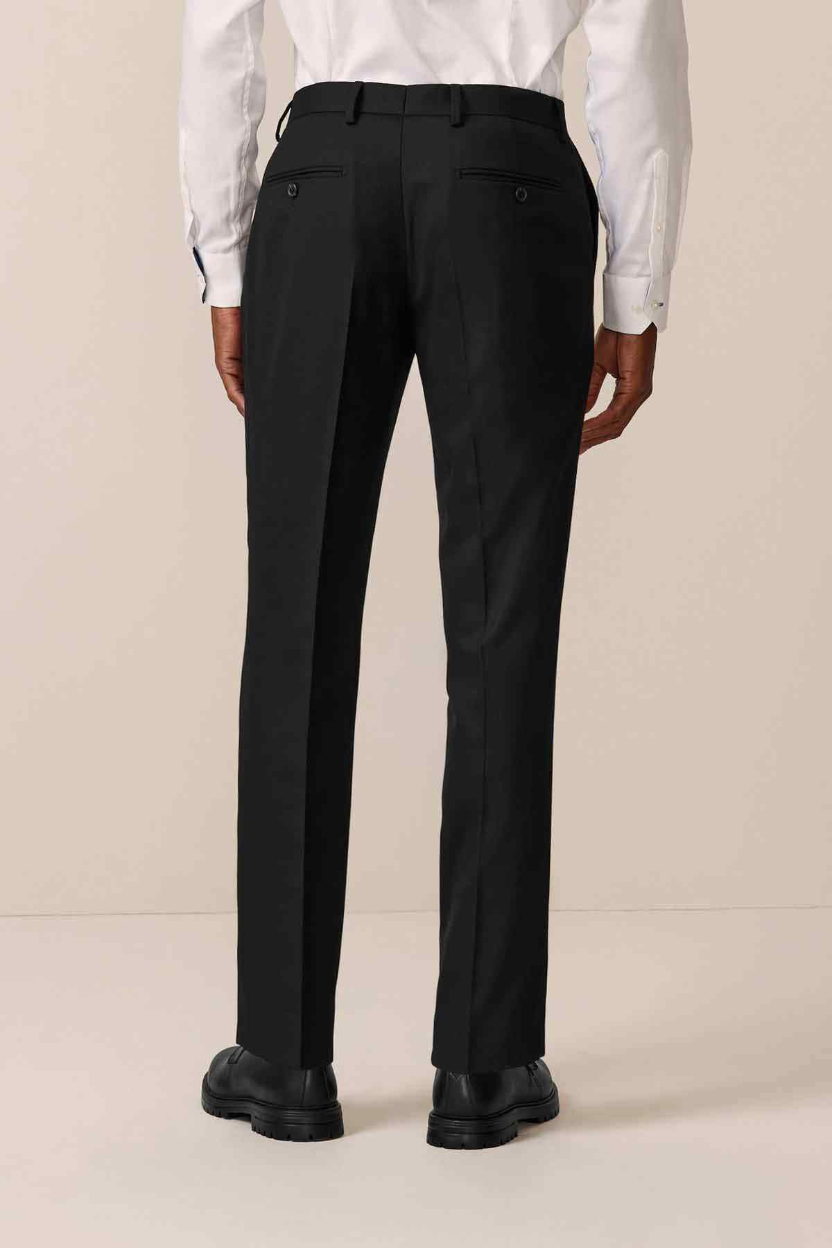 Black tailored trousers back view, crease detail and belt loops
