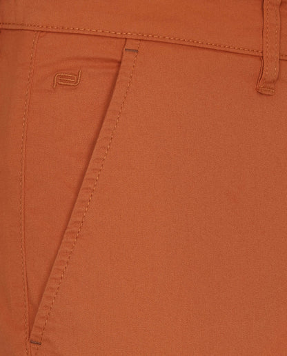 Orange pants front pocket and stitch details, close-up