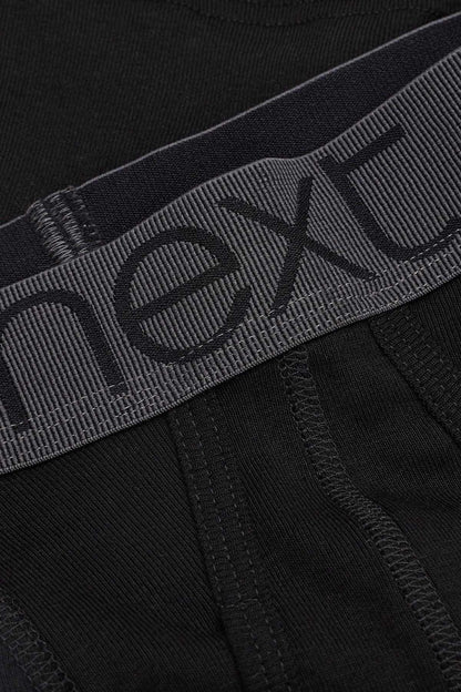 Black boxer brief waistband close-up with NEXT printed logo