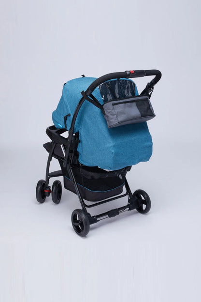 Grey stroller organizer bag attached to stroller frame