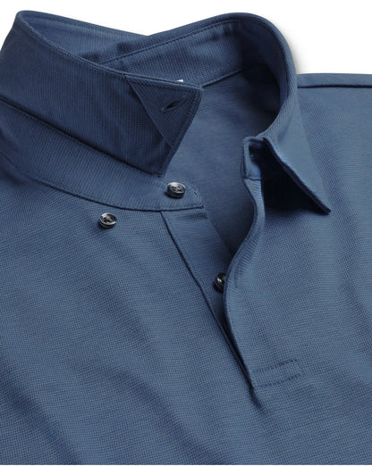 Blue polo shirt collar and buttoned placket close-up