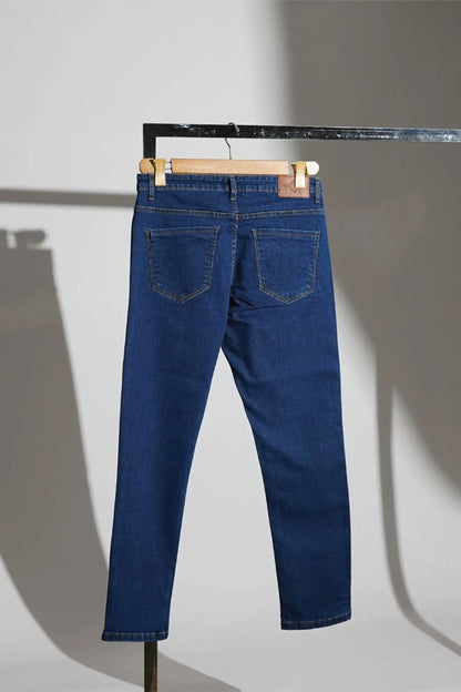 Blue denim jeans with back pockets, belt loops, and stitched hems