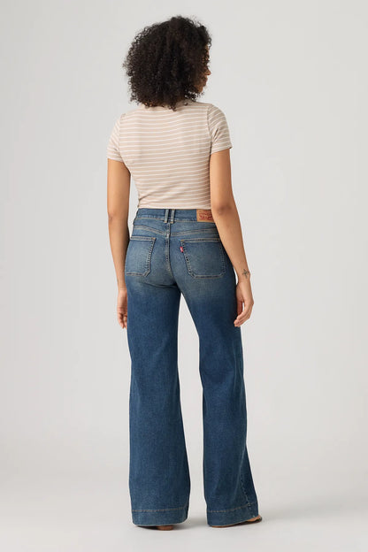 Levi's medium indigo wide-leg jeans, back view with waistband and belt loops.