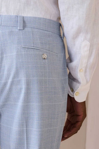 Light blue check suit trousers close-up of front pocket and button