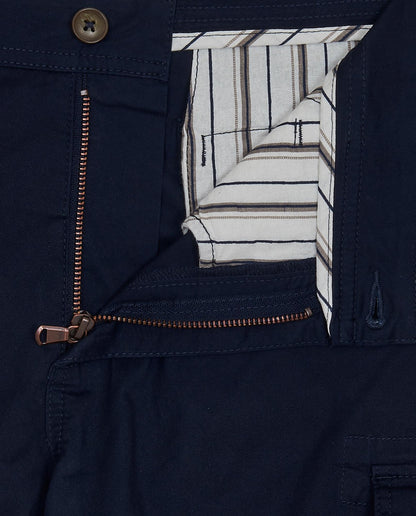 Navy cargo shorts close-up: zipper side pocket with striped lining