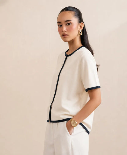Fitted button-front knit top, cream with navy trim and short sleeves