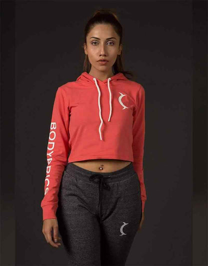 Cropped red hoodie with sleeve branding and front crescent logo