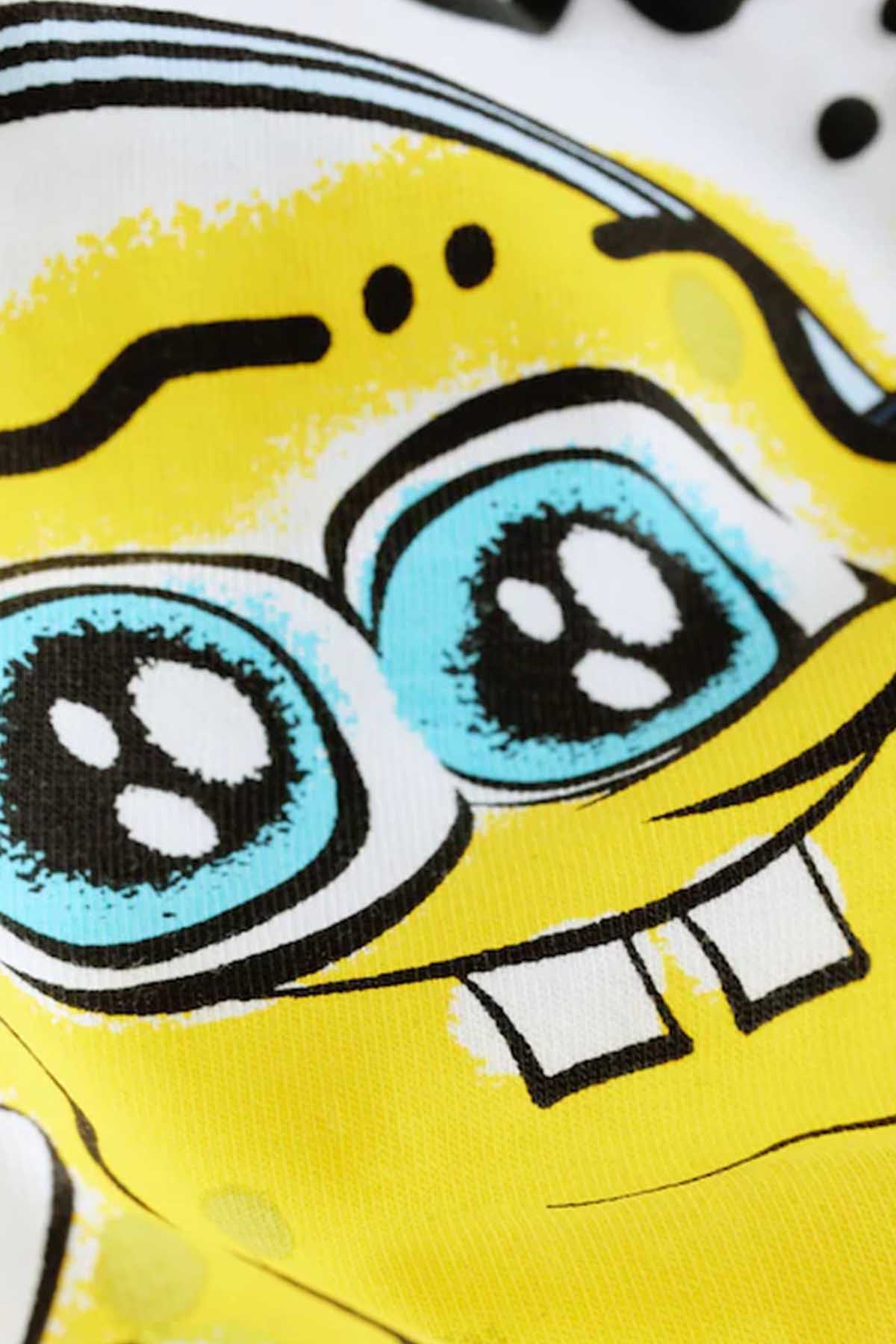 Close-up of yellow SpongeBob face print on white T-shirt