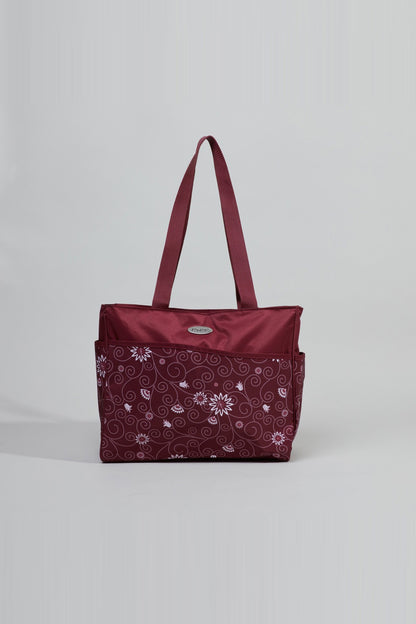 Burgundy tote bag with patterned front panel and two handles