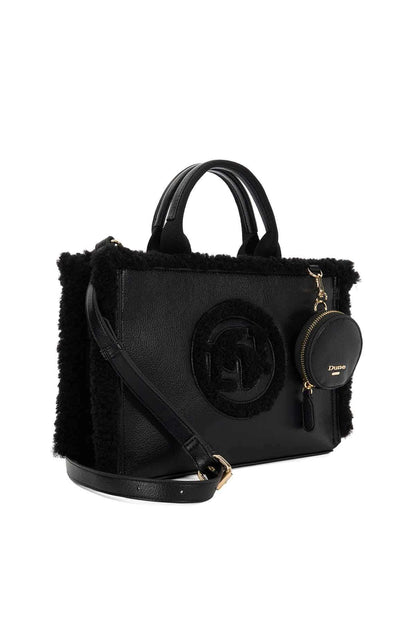 Black handbag with fuzzy trim, top handles, front circular logo detail, and shoulder strap.