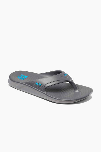 Reef grey flip-flops, side angle view, textured sole and blue logo on strap