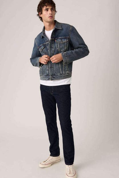 Levi's dark blue denim jacket with button-front, chest pockets, and long sleeves