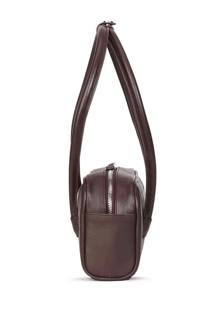 Dark-brown small handbag with long top handle and compact front zipper pocket.