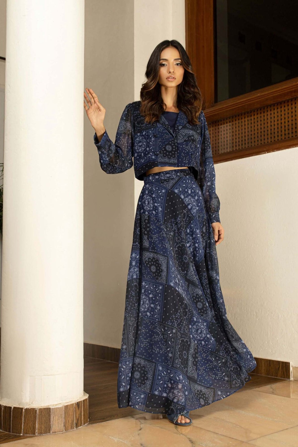 Blue velour maxi dress with patchwork print, long sleeves, and wide flared skirt