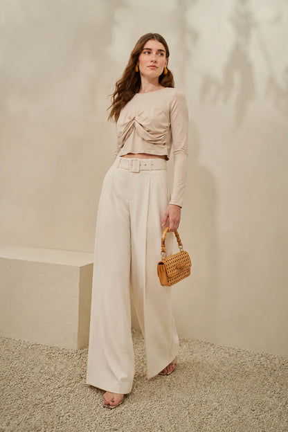 Beige ruched draped cropped top with long sleeves and flowy wide-leg pants