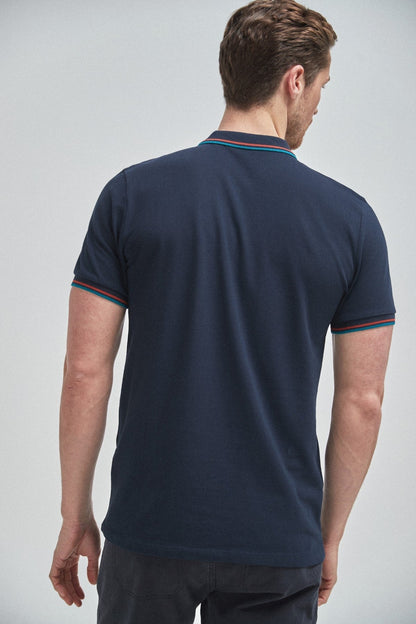 Navy short-sleeve polo shirt with contrast trim at collar and sleeve cuffs (back view)