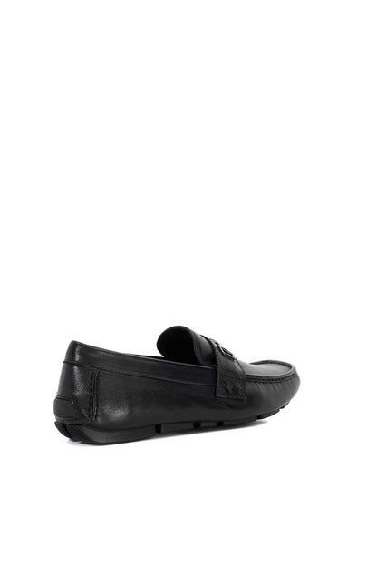 Black leather slip-on loafer with side buckle and low-profile sole