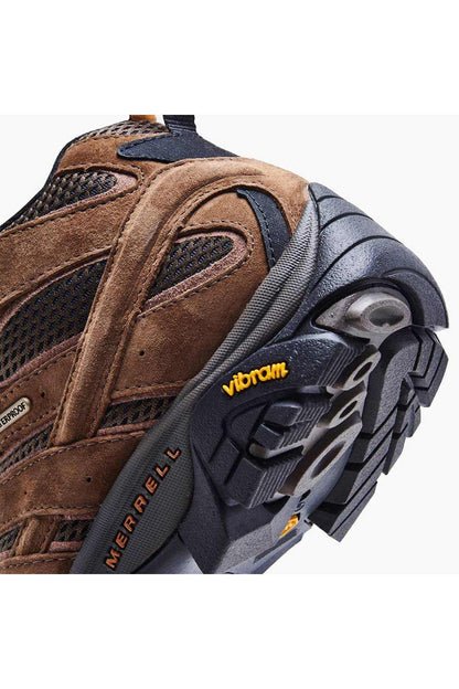 Merrell hiking shoes close-up with Vibram sole texture and rugged side stitching