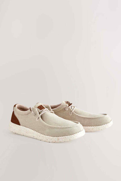 Pair of beige and brown casual sneakers with lace-up design