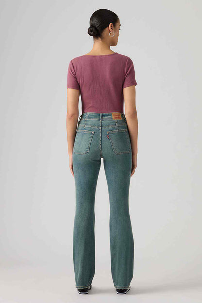 Levi's mid-indigo bootcut jeans, back view with two rear pockets and yoke