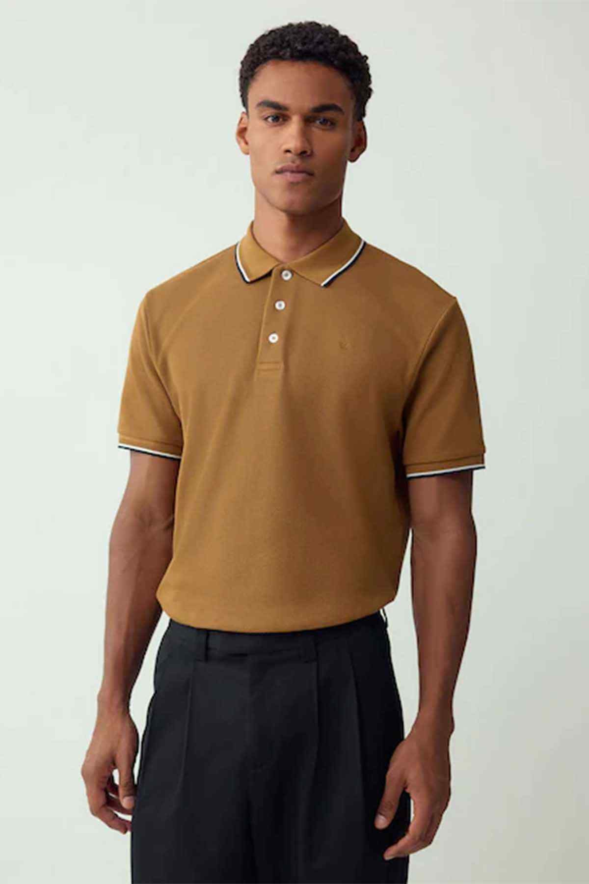 Tan polo shirt with white-and-navy trim, 3-button placket, short sleeves