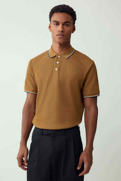 Tan polo shirt with white-and-navy trim, 3-button placket, short sleeves