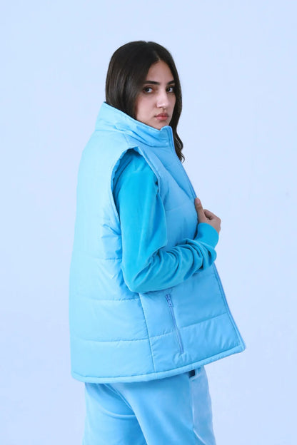 Blue quilted puffer vest with hood, front zipper and side pockets