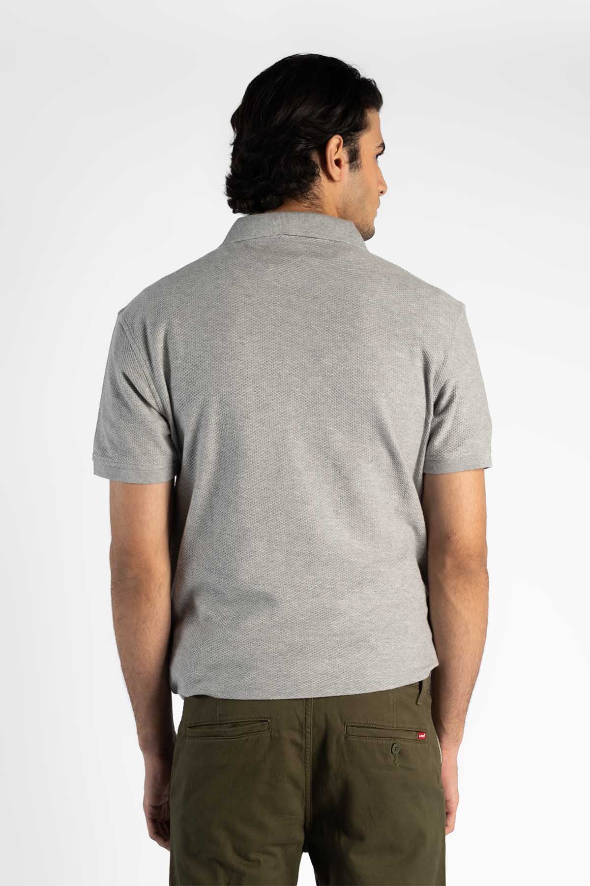 Back view of Levi's grey polo shirt, short sleeves, small red logo on hem
