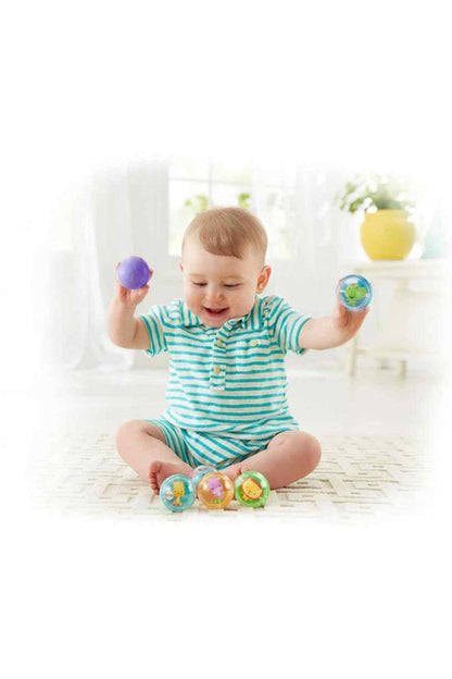 BABYSHOP baby playing with colorful ball toys, striped romper, sitting on floor
