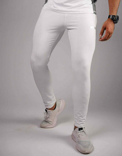 White compression leggings with tapered legs and smooth mid-rise waistband