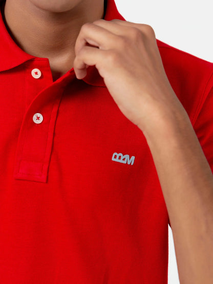 Red cotton polo shirt close-up of collar, buttons, and chest logo