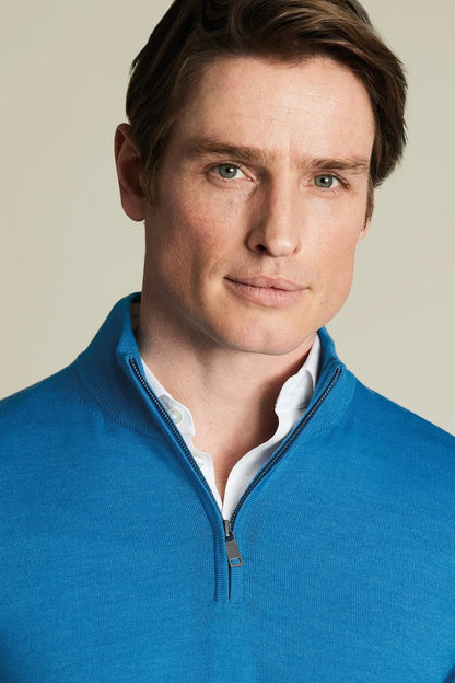 Blue knit quarter-zip sweater with zip placket and light collared neckline