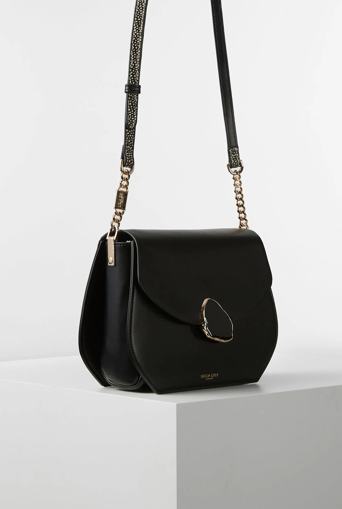 Black mini crossbody bag with oval ring clasp and adjustable chain straps