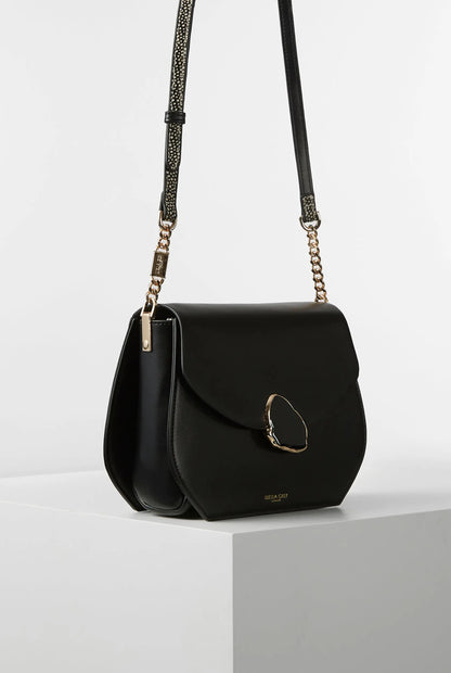 Black mini crossbody bag with oval ring clasp and adjustable chain straps
