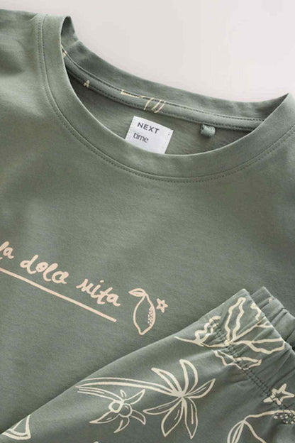 Sage green crew-neck T-shirt neckline with white graphic text print