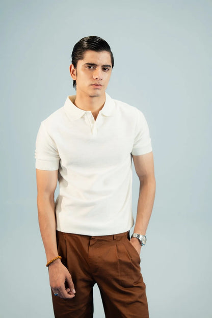 Brackets polo shirt and trousers: white polo with button placket and brown trousers